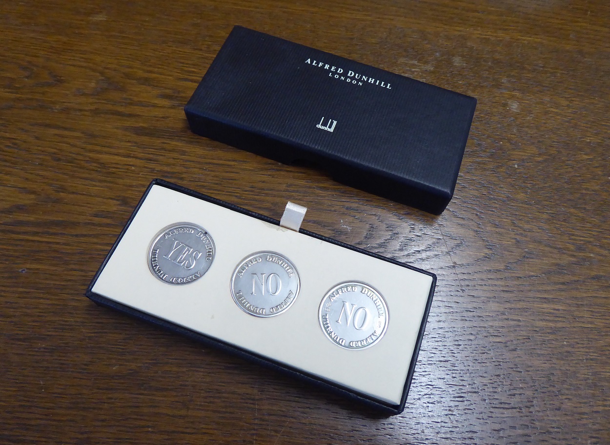 An Alfred Dunhill Yes / No Sterling Silver Coin Set